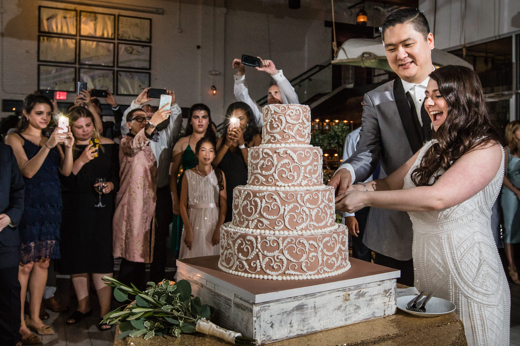 bride and groom cut the cake at Battello Jersey City Wedding Reception