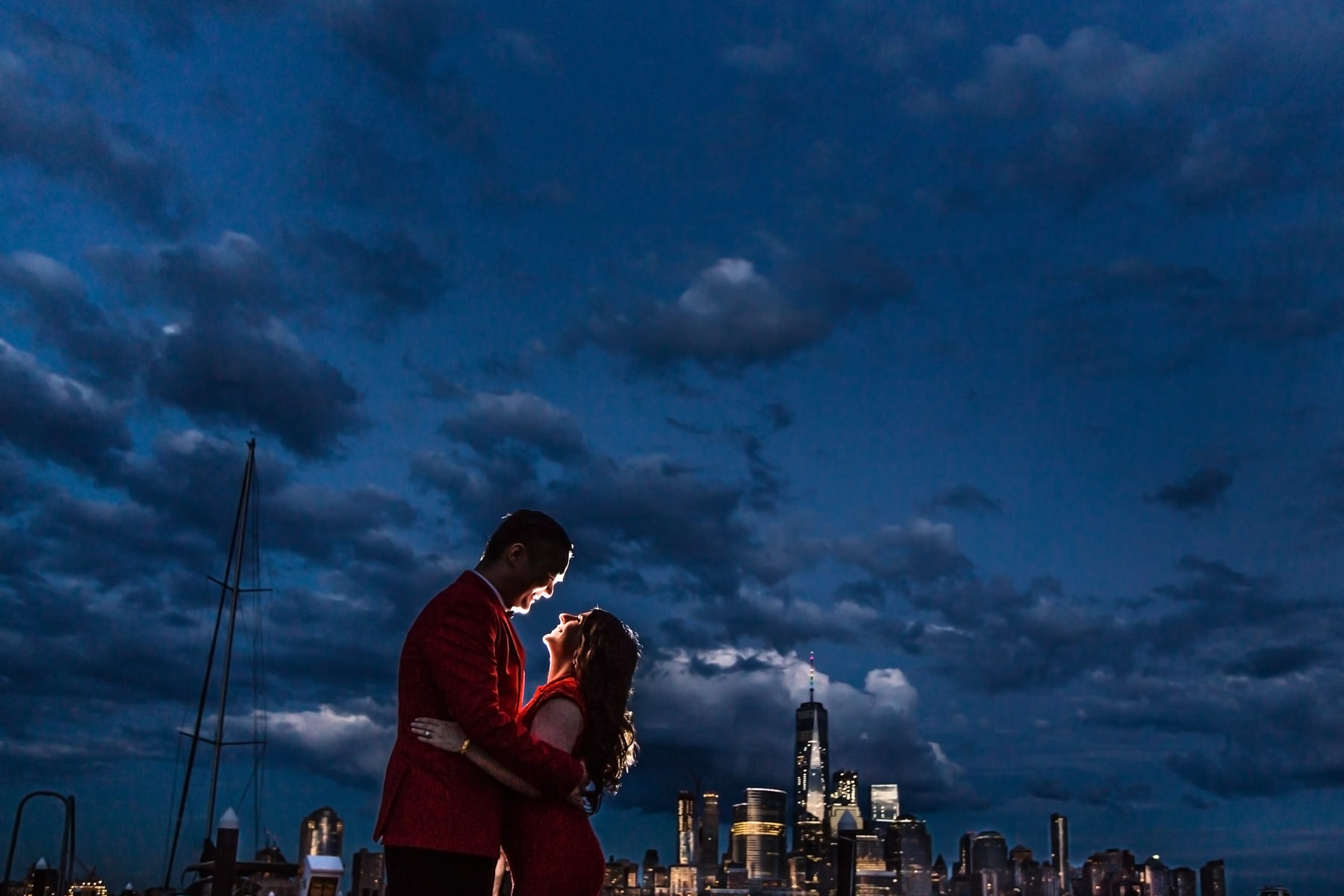 Night portait of bride and groom taken from Battello Jersey City Wedding Reception; NYC skyline