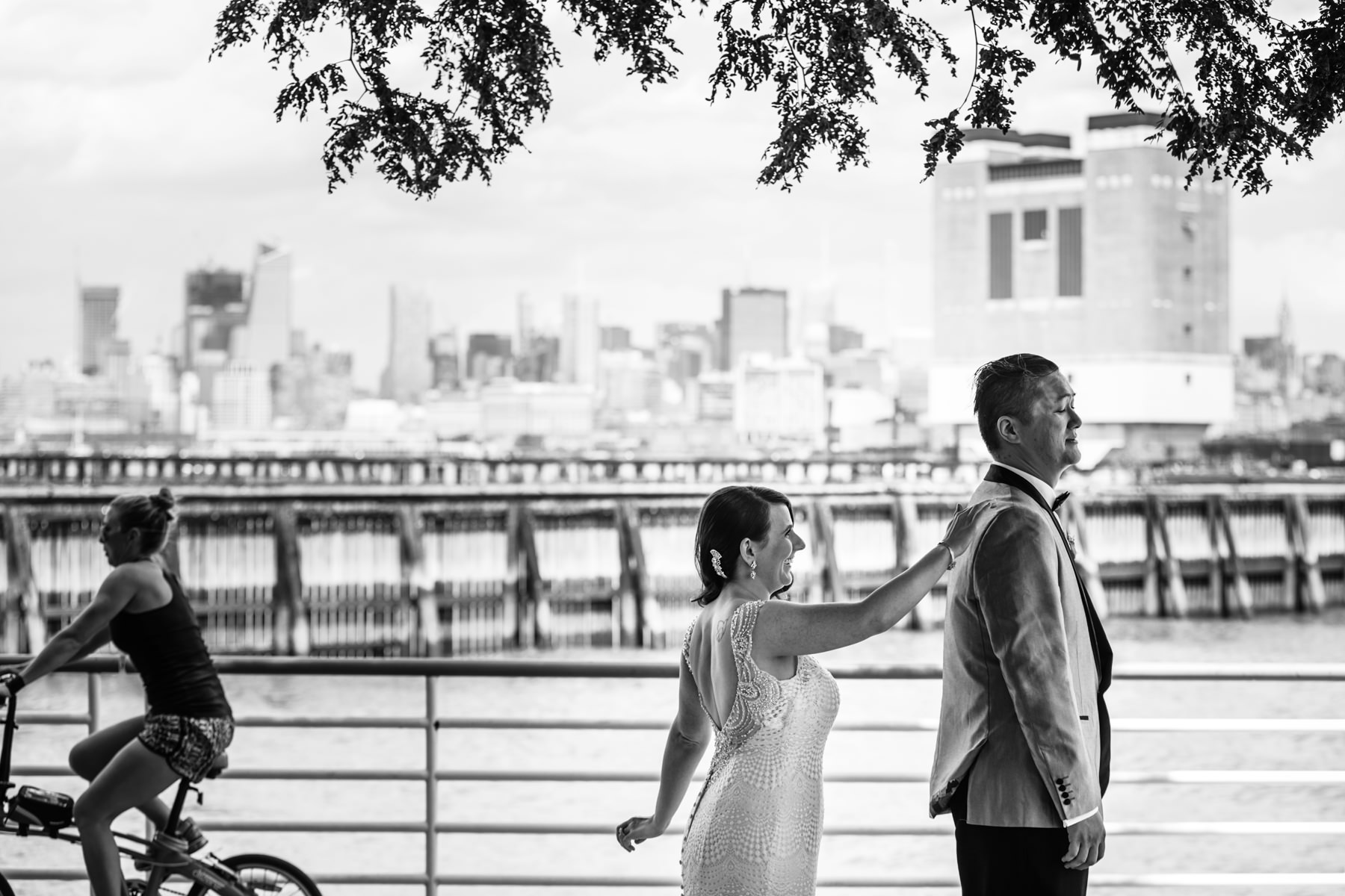 First look of bride and groom on a pier in Jersey City