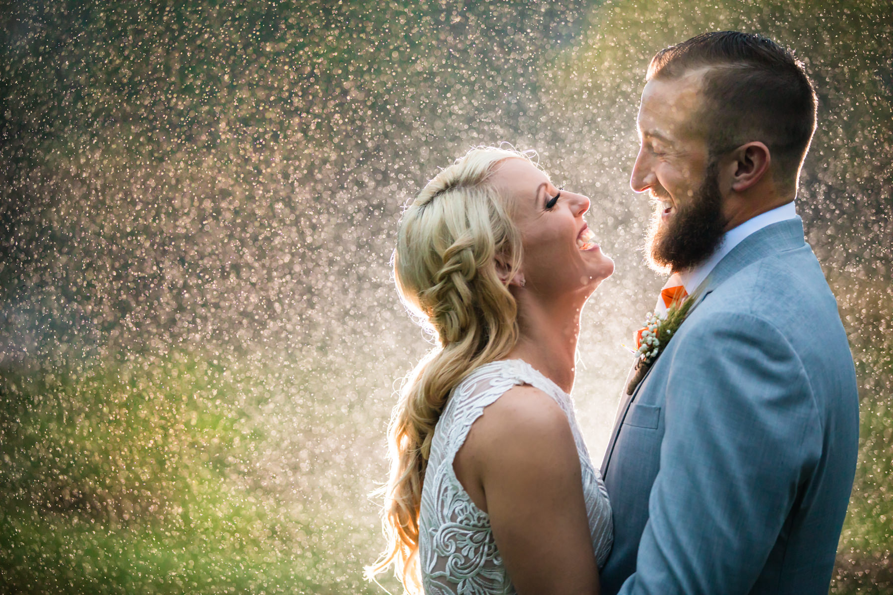 Bride and groom portrait in the rain