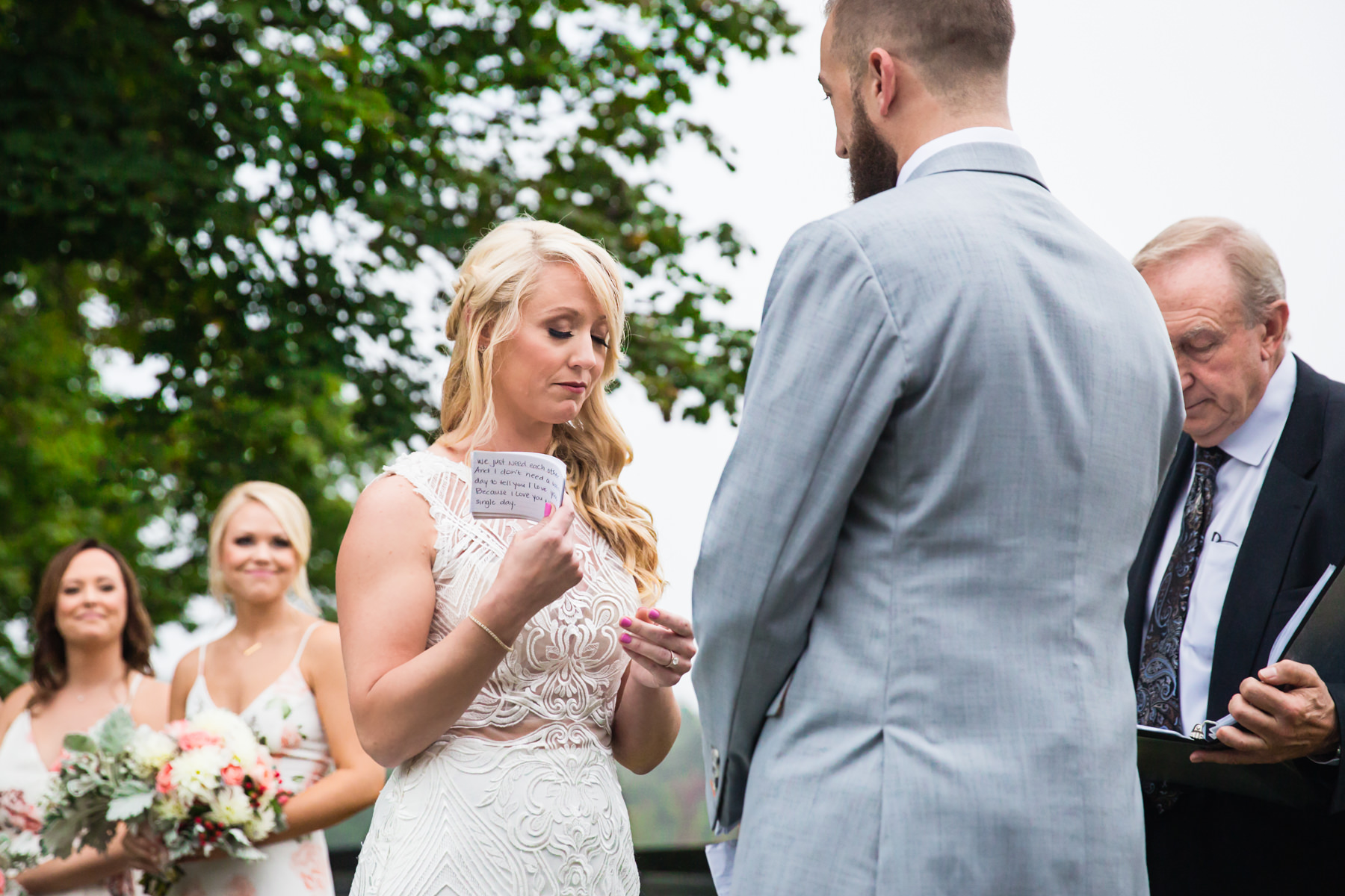 bride is overcome with emotion as she reads her vow at Stone Rows Farm Wedding, Stockton, NJ