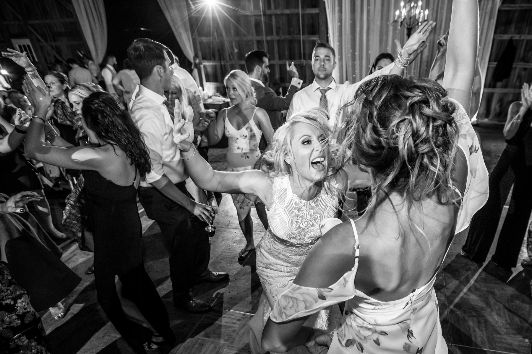 Bride dancing at her wedding reception at her rustic farm wedding in Stockton, NJ