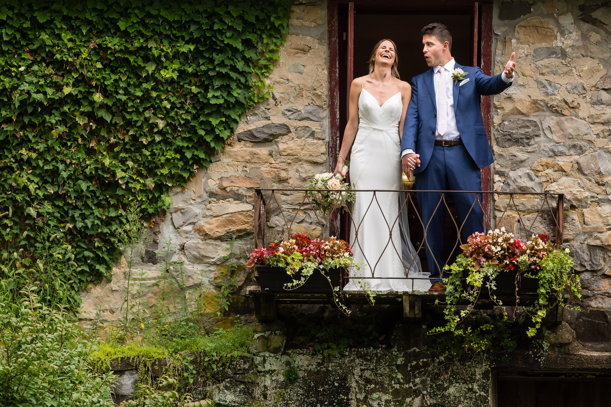 Bride and groom on balcony at Crossed Keys Estate