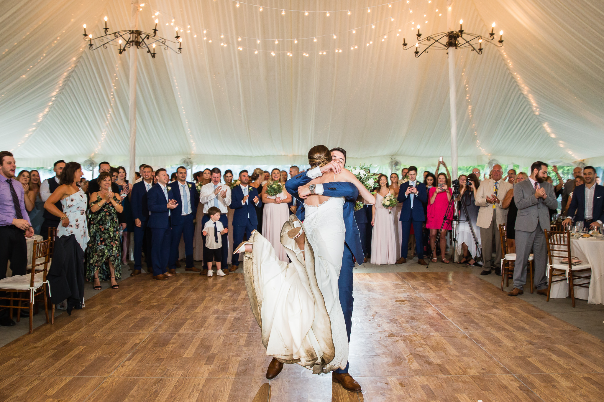 Bride and groom first dance under tent at Crossed Keys Estate wedding