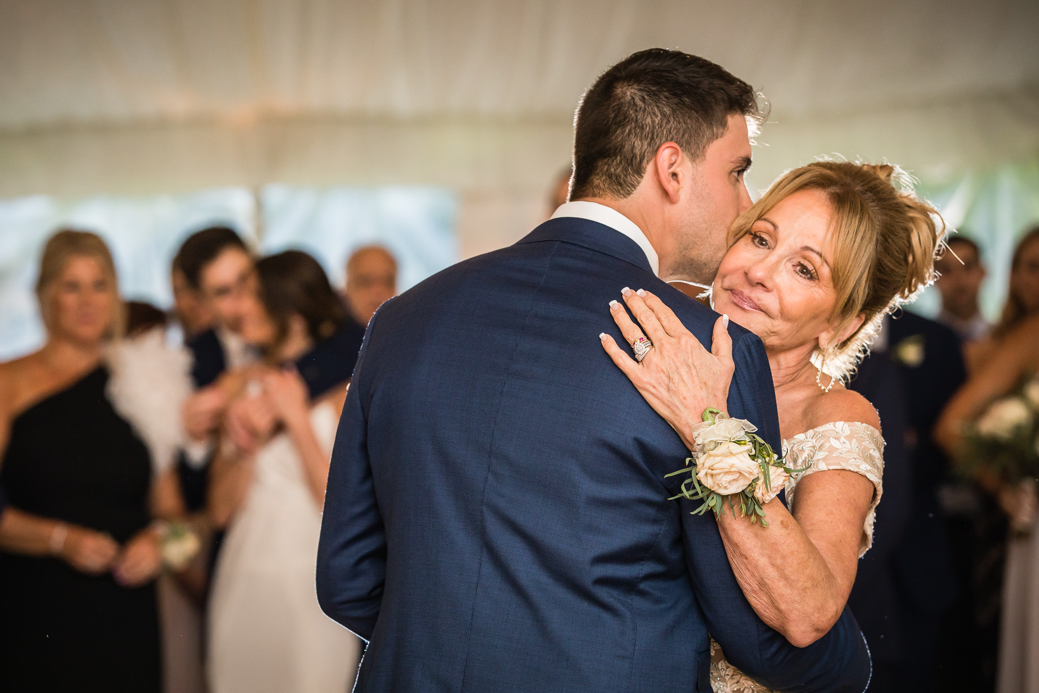 emotional mother of groom dances with her son at his wedding at Crossed Keys Estate