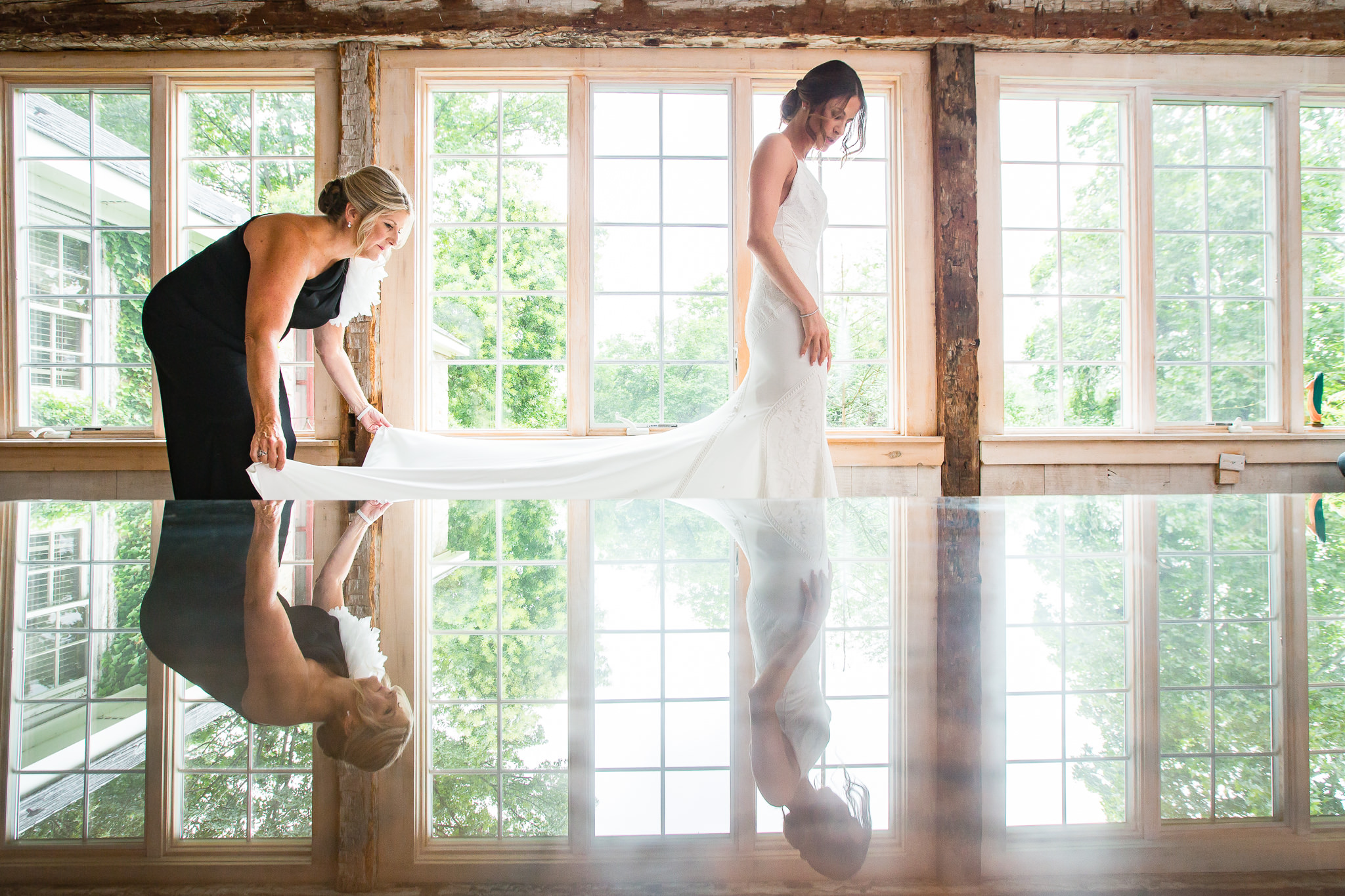 Bride gets dressed at Crossed Keys estate