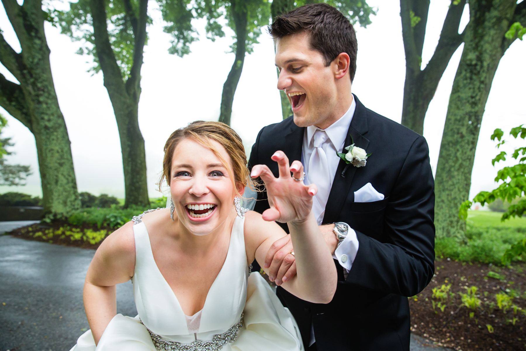 Playful bride and groom at Overbrook Golf Club in Radnor, PA