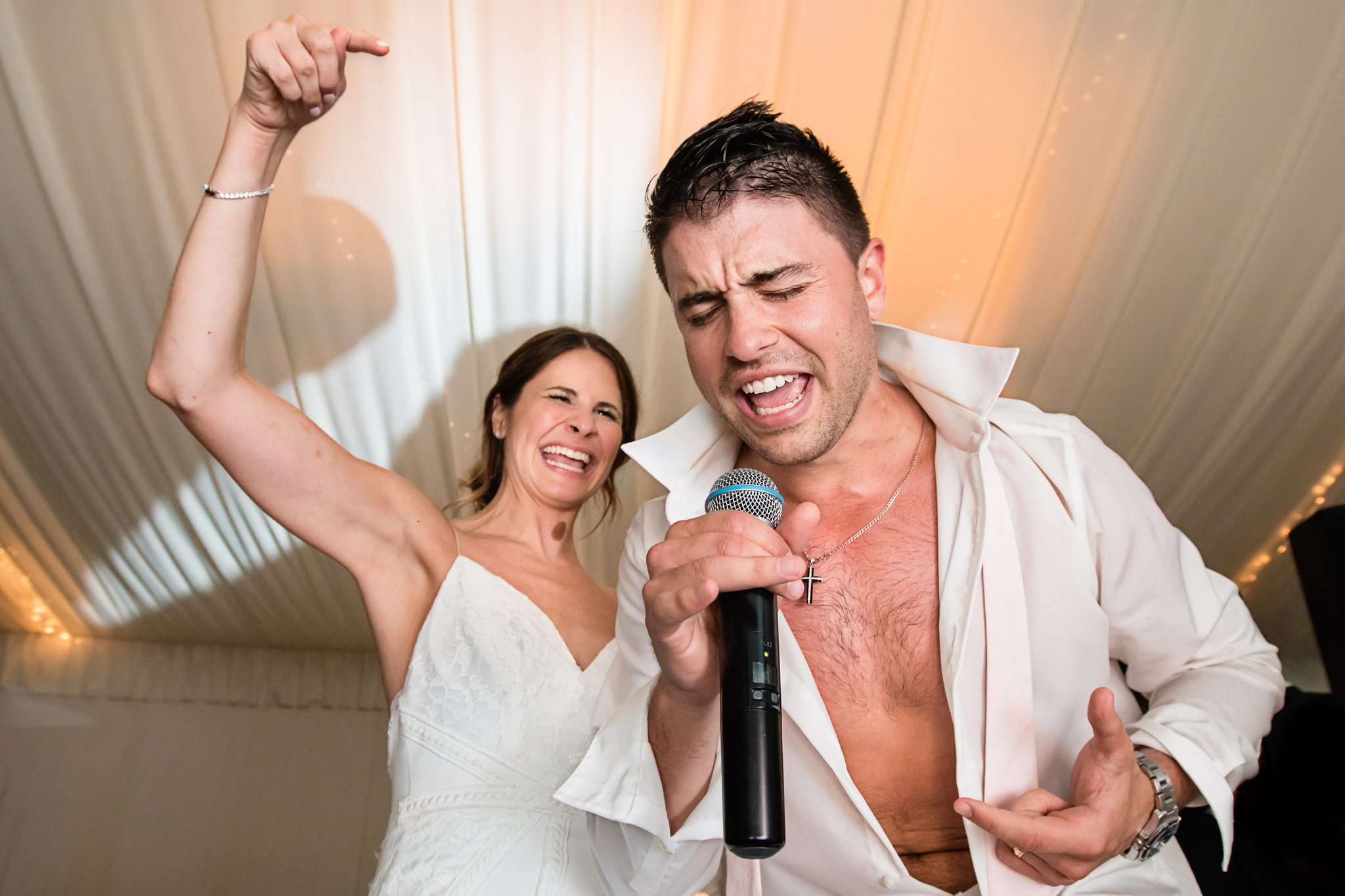 Bride and groom sing and dance at their wedding at Crossed Keys Estate