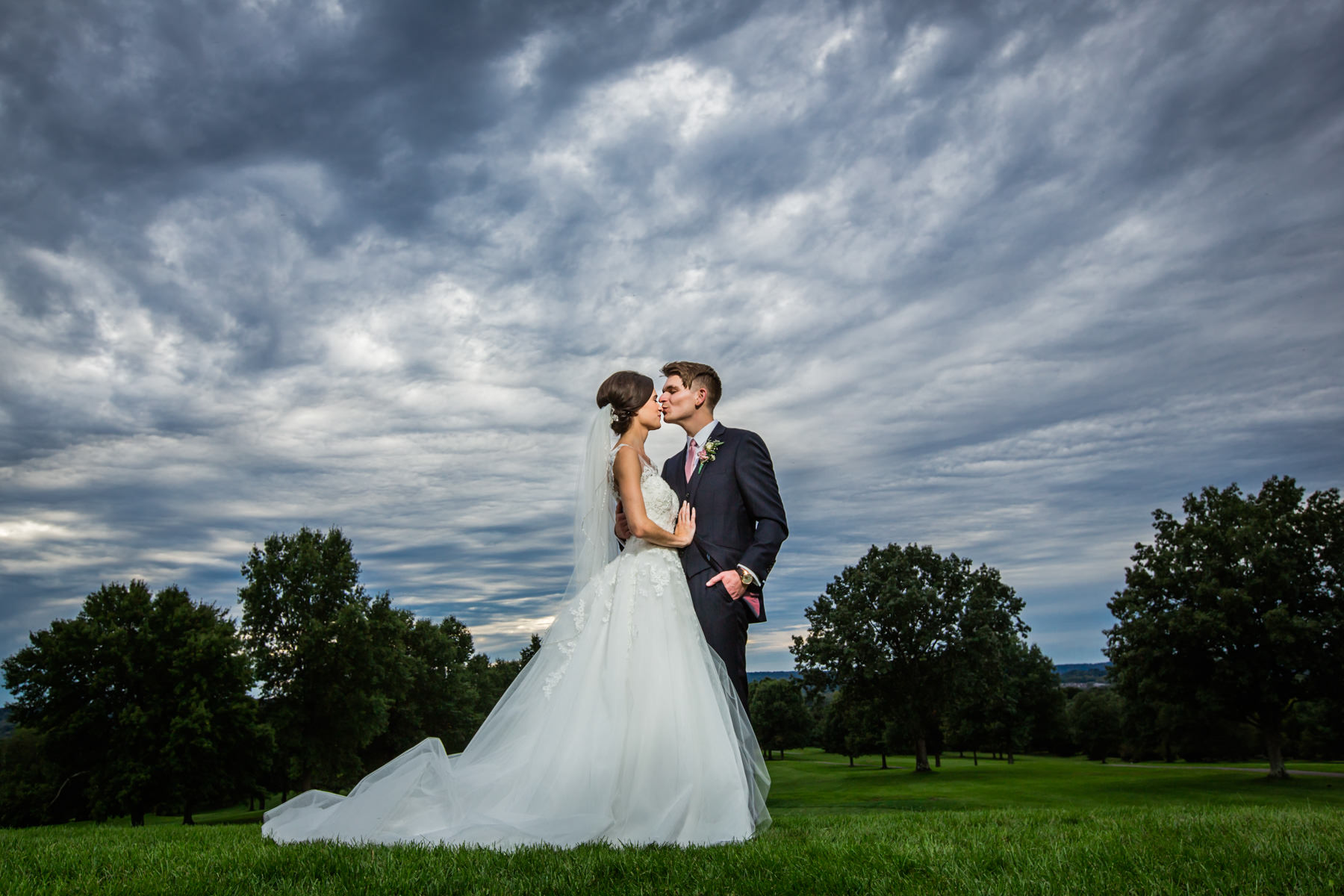 Beaver Brook Country club wedding photo with dramatic and stormy sky