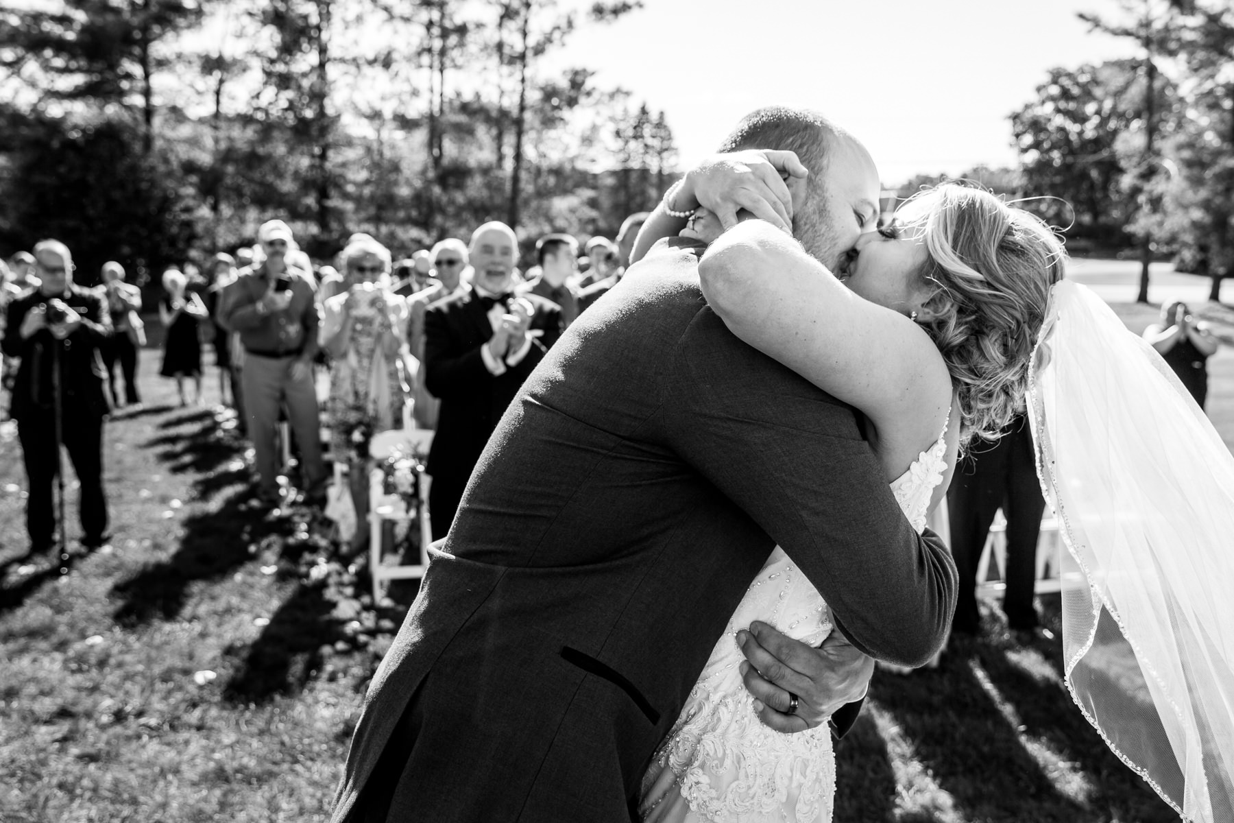 First kiss at Perona Farms outdoor wedding ceremony