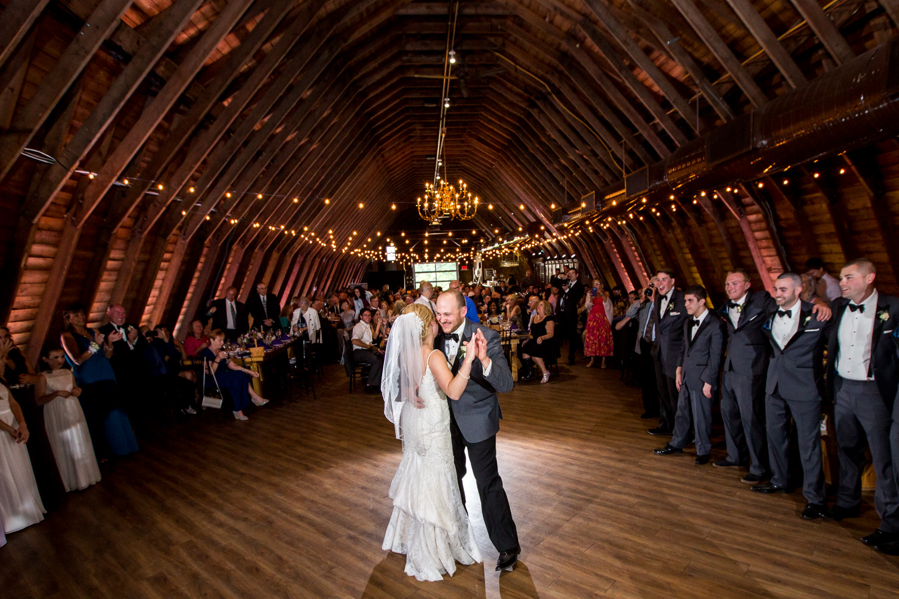 First dance at wedding reception in barn at Perona Farms