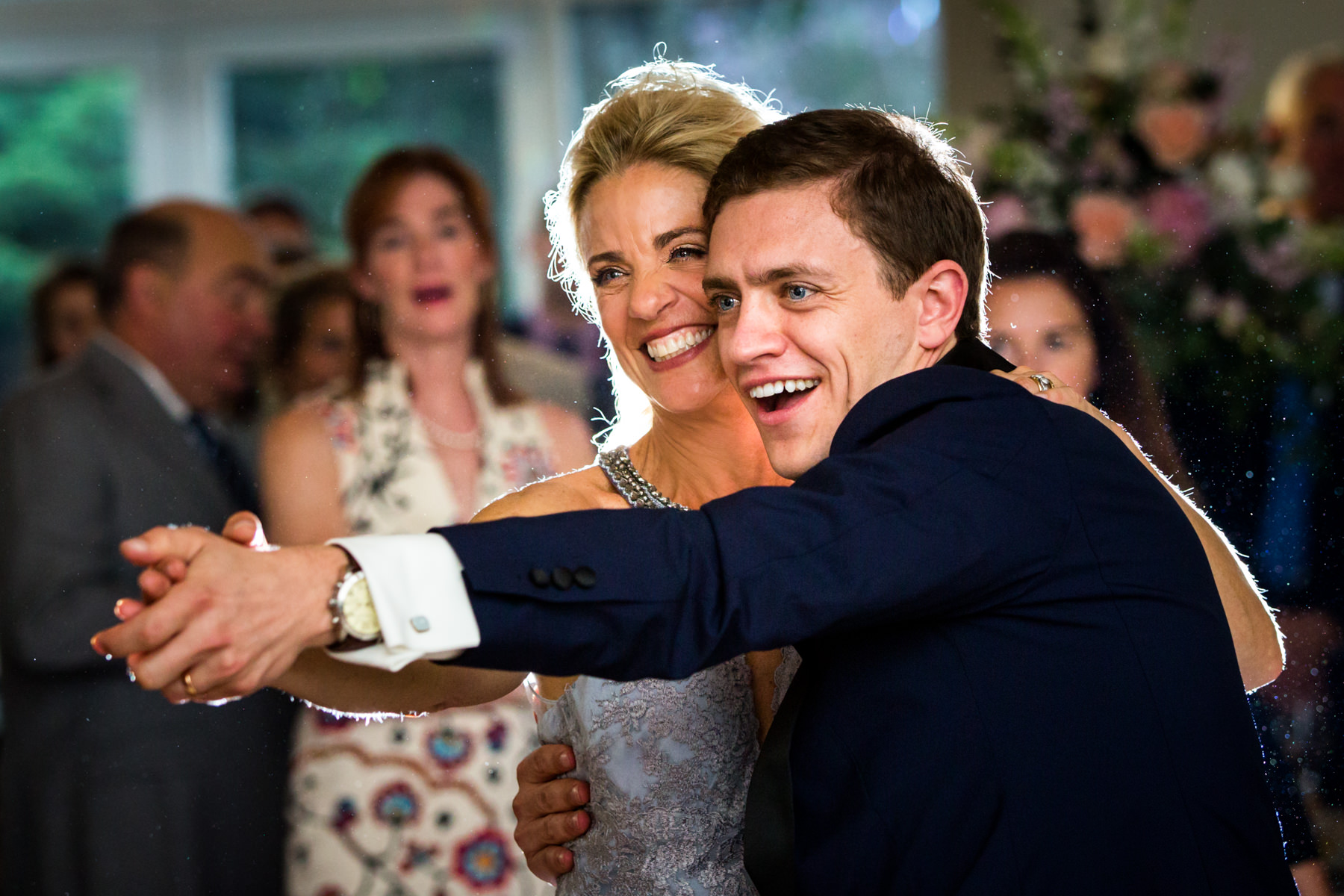 groom dancing with mother