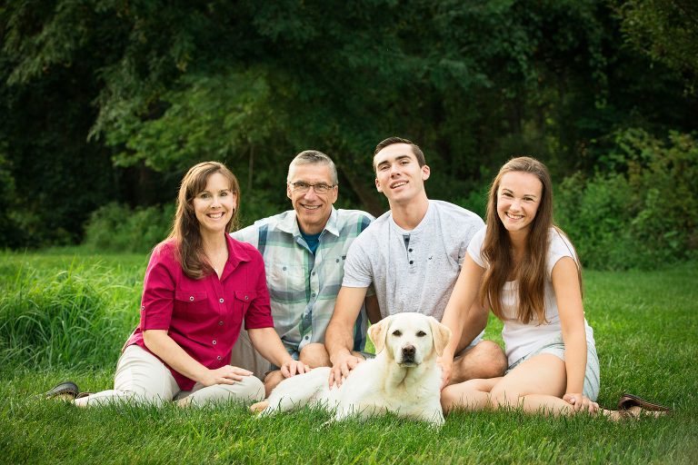 Gorgeous family portrait in backyard with their dog in Clinton, NJ
